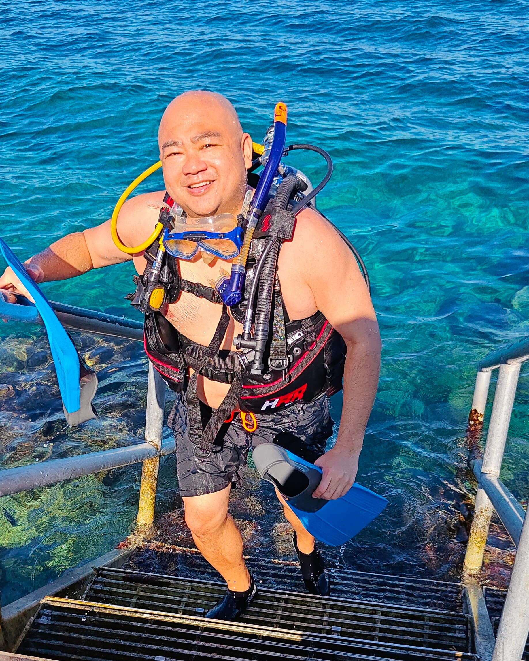 Kris exiting the water after a dive.